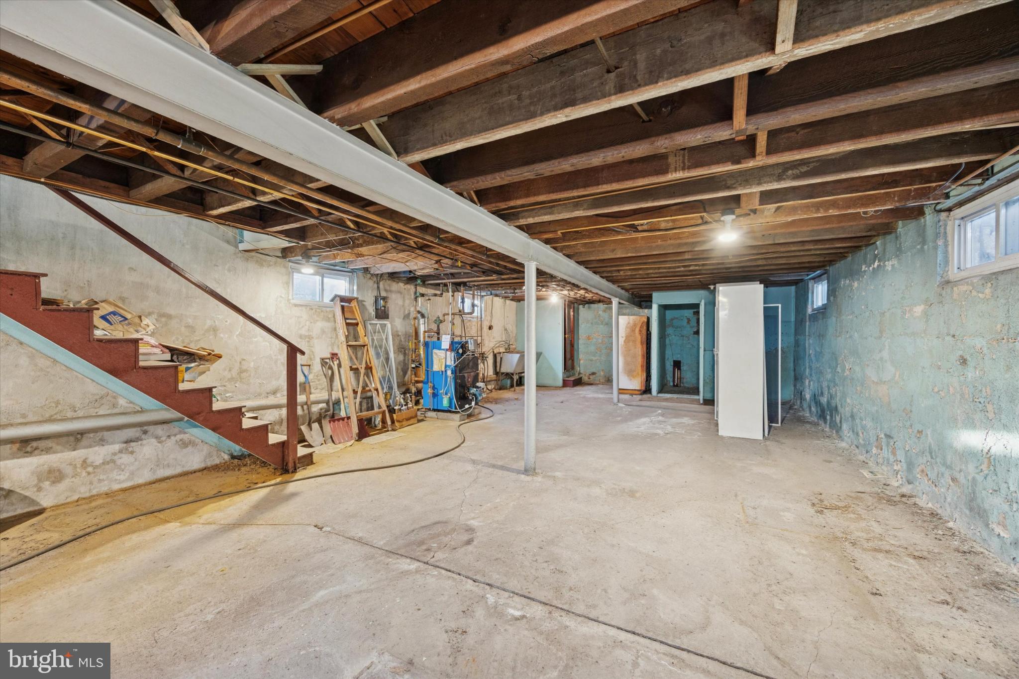 104 Monroe Street Bristol, PA 19007 - Photo 12 of 14 Spacious unfinished basement with potential.