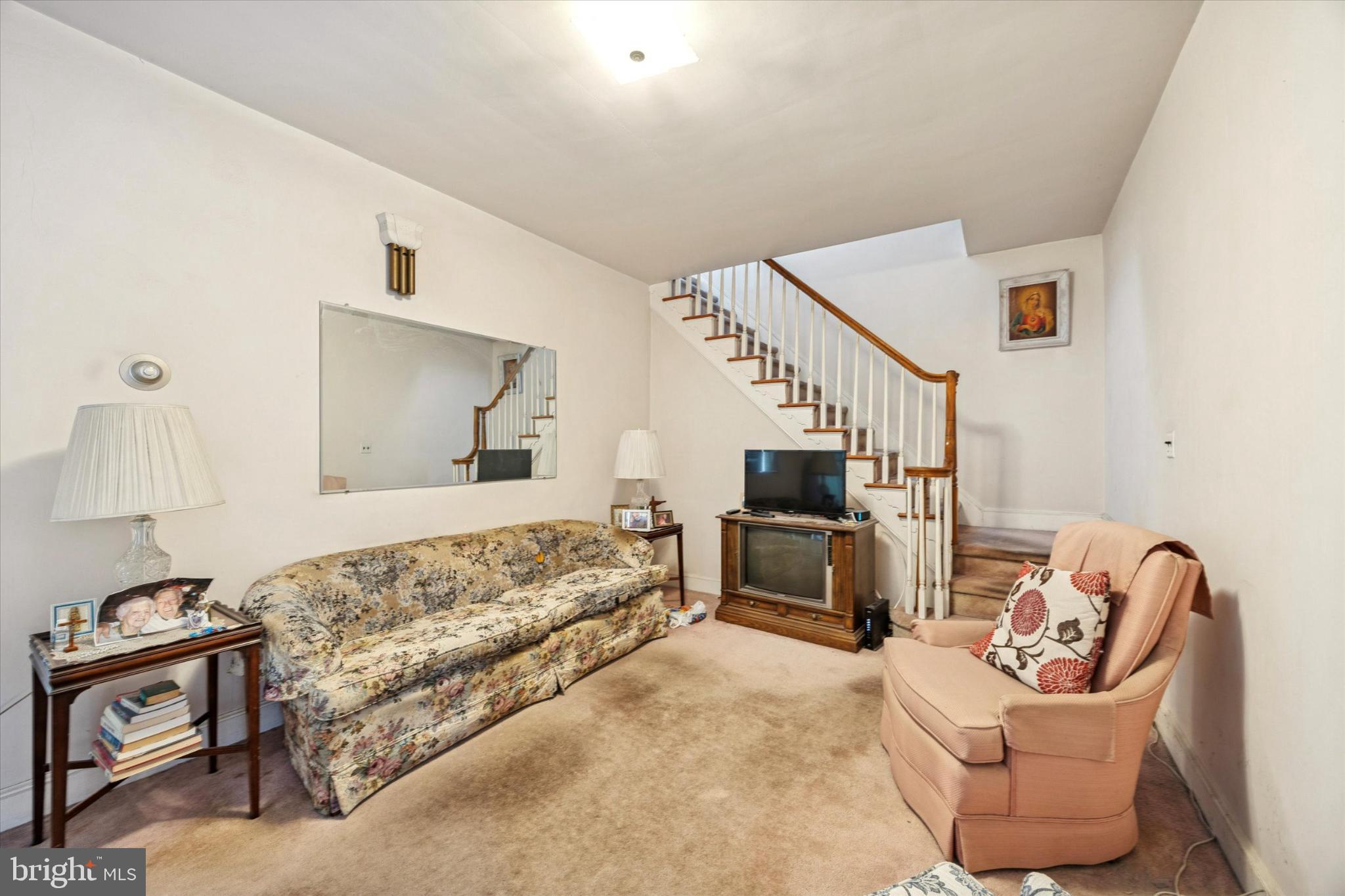 104 Monroe Street Bristol, PA 19007 - Photo 2 of 14 Cozy living space with inviting staircase.