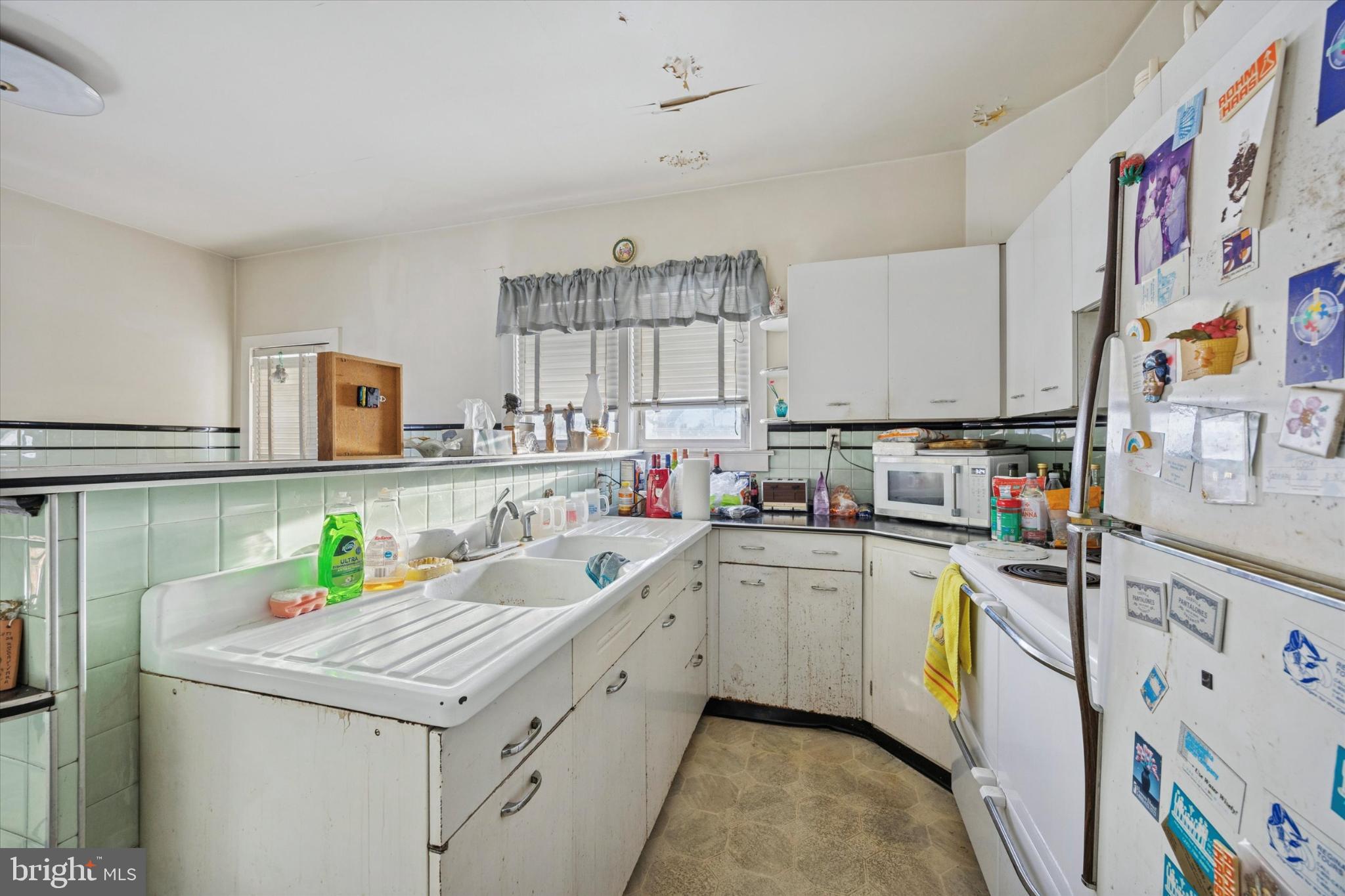 104 Monroe Street Bristol, PA 19007 - Photo 5 of 14 Charming vintage kitchen with ample light.