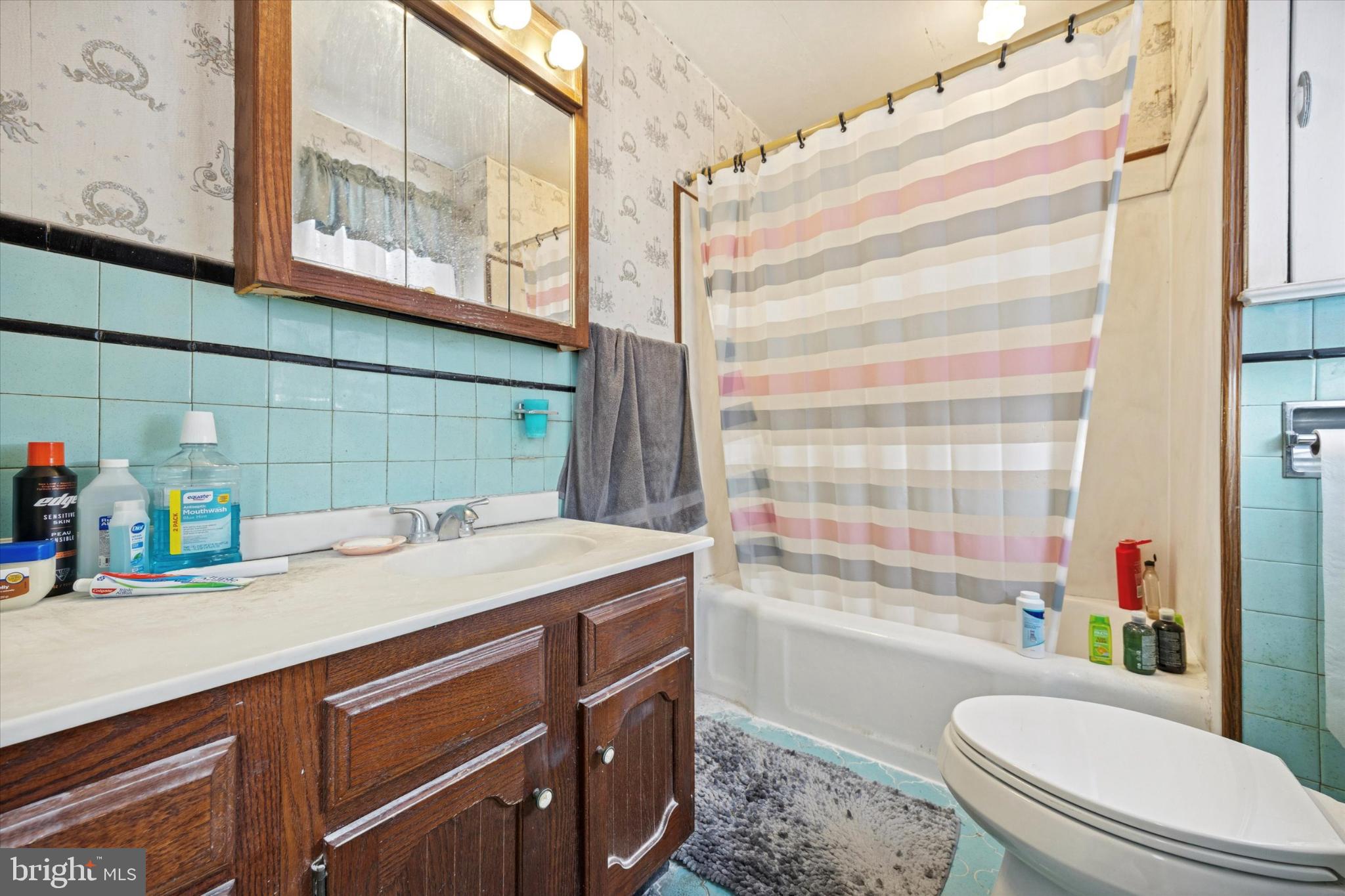 104 Monroe Street Bristol, PA 19007 - Photo 7 of 14 Charming vintage bathroom with retro tiles.