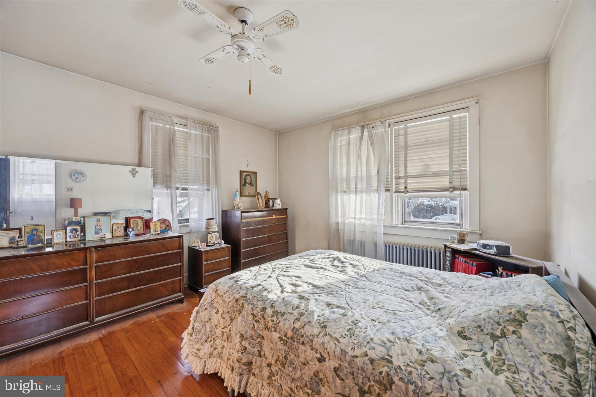 104 Monroe Street Bristol, PA 19007 - Photo 8 of 14 Cozy bedroom with natural light and charm.