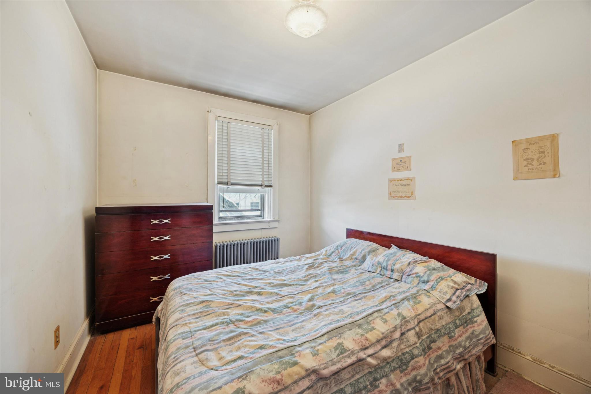 104 Monroe Street Bristol, PA 19007 - Photo 9 of 14 Cozy bedroom with natural light and charm.