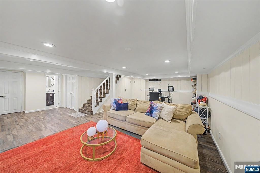 45 Highfield Road Bloomfield, NJ 07003 - Photo 40 of 50 a living room with furniture and a wooden floor