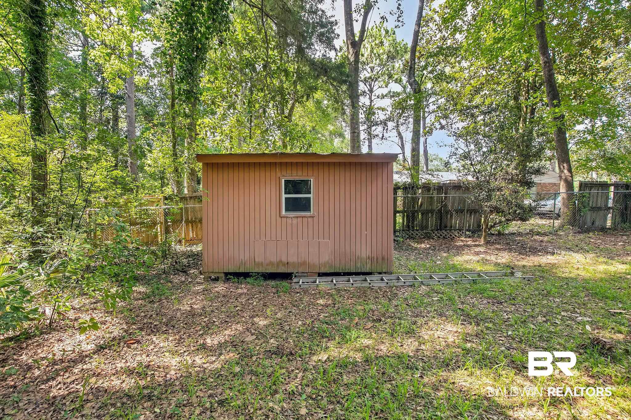 3304 Armond Drive Mobile, AL 36605 - Photo 53 of 62 View of shed with a fenced backyard