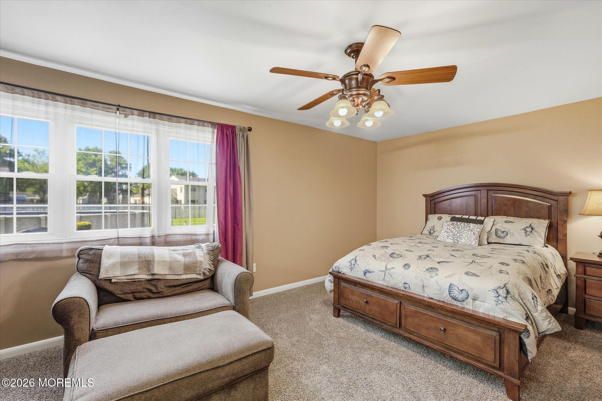 22 Ethan Allen Road Freehold, NJ 07728 - Photo 22 of 31 a bedroom with a bed couch and window