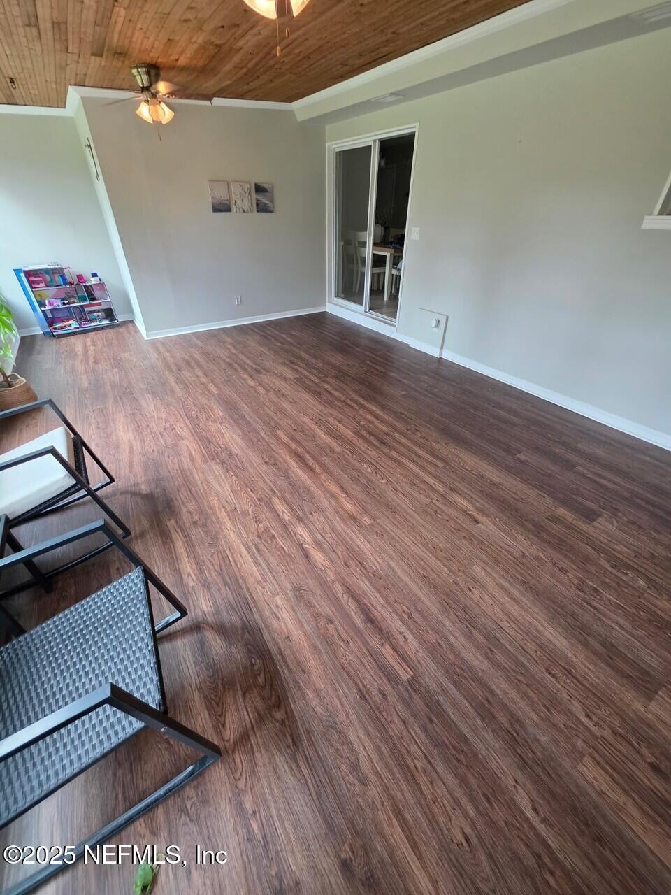 11599 Lake Ride Drive Jacksonville, FL 32223 - Photo 28 of 38 a view of a livingroom with wooden floor and staircase