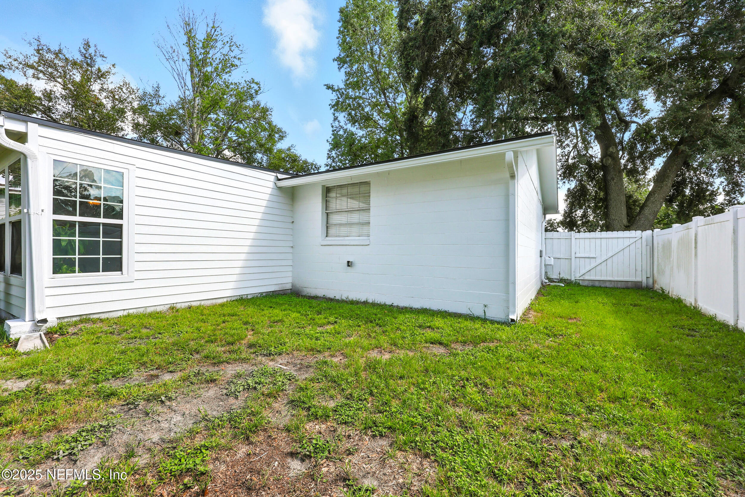11599 Lake Ride Drive Jacksonville, FL 32223 - Photo 33 of 38 a view of a backyard with a garden