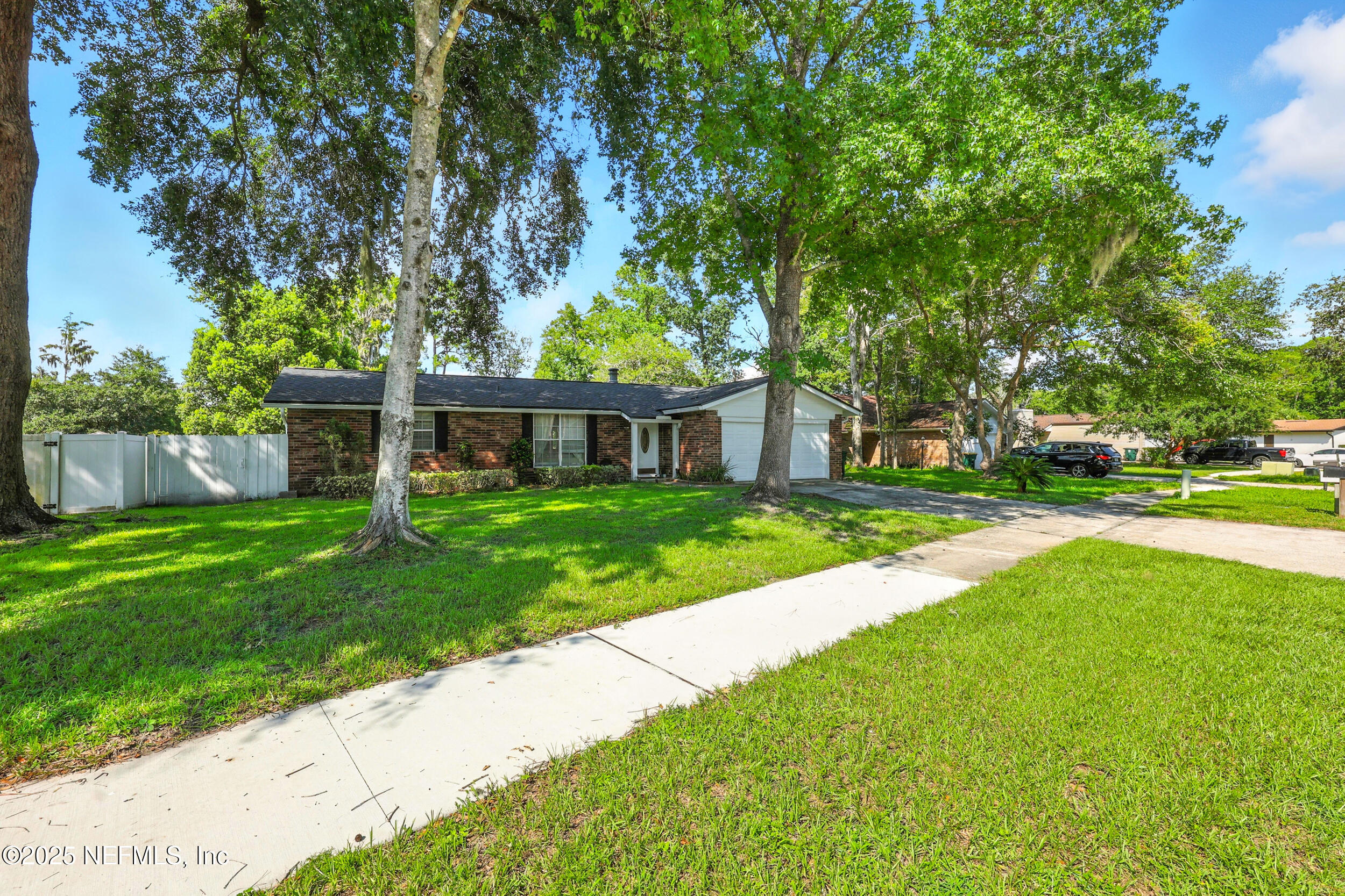 11599 Lake Ride Drive Jacksonville, FL 32223 - Photo 5 of 38 a front view of house with yard and green space