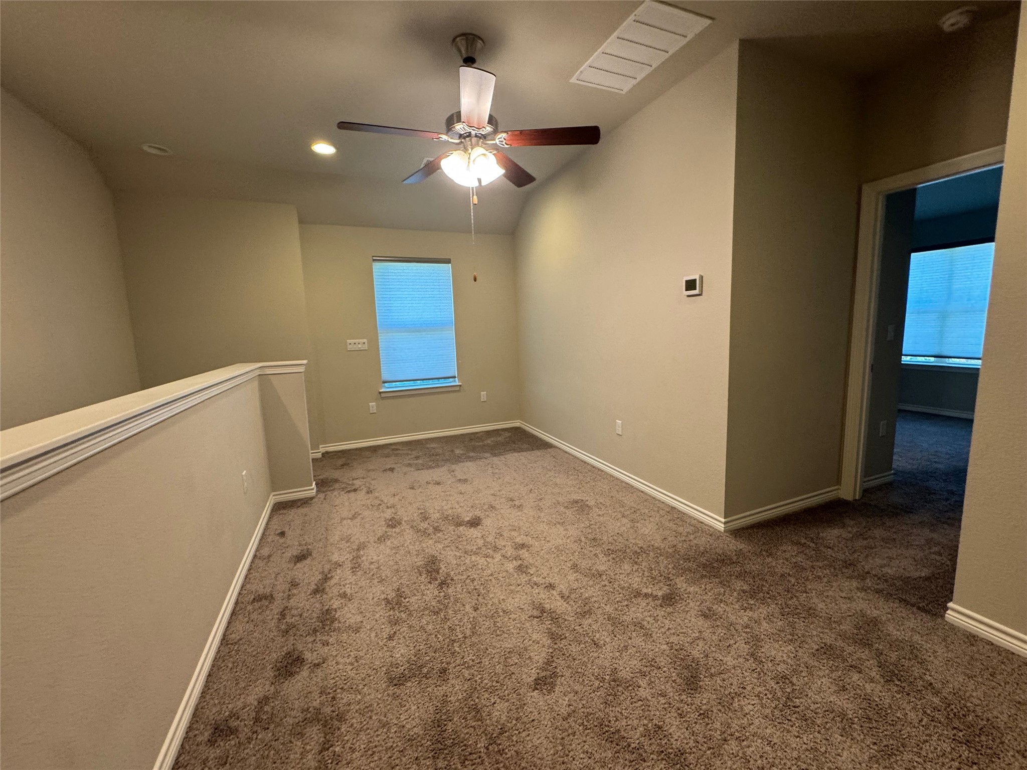 14100 McCoy Loop, Unit 1 Austin, TX 78717 - Photo 33 of 39 A versatile bonus space features soft carpeting and a window for natural illumination.