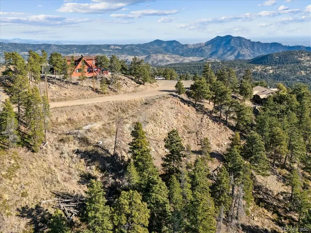 a view of a city with mountains in the background
