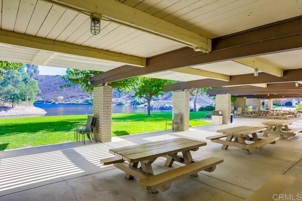2686 Via Viejas Alpine, CA 91901 - Photo 36 of 40 a view of a patio with table and chairs potted plants with wooden floor and fence