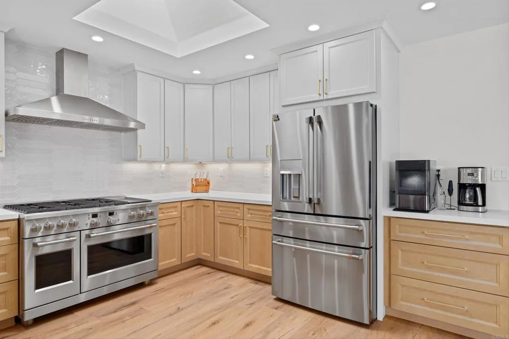 2686 Via Viejas Alpine, CA 91901 - Photo 10 of 40 a kitchen with cabinets stainless steel appliances and wooden floor