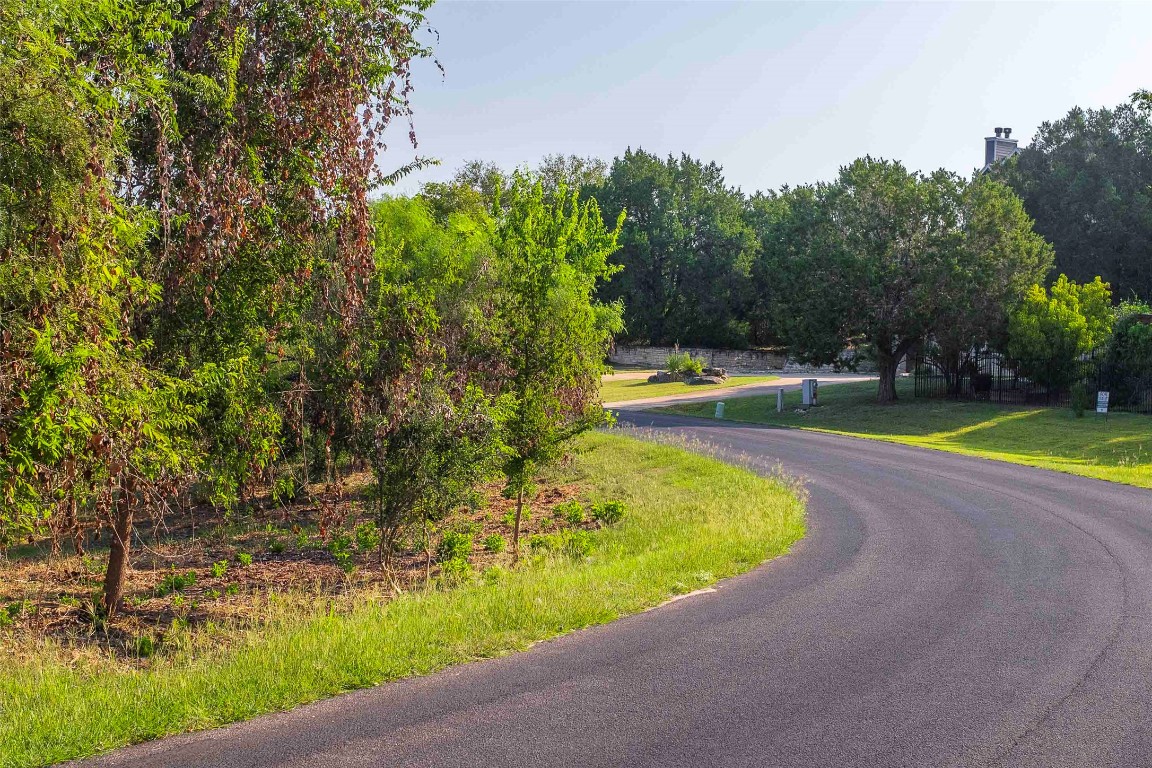 Lot 64 Wesley Ridge Drive Spicewood, TX 78669 - Photo 20 of 32 a view of a swimming pool with a yard