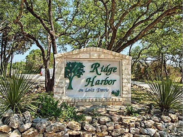 Lot 64 Wesley Ridge Drive Spicewood, TX 78669 - Photo 28 of 32 a sign on the side of a road