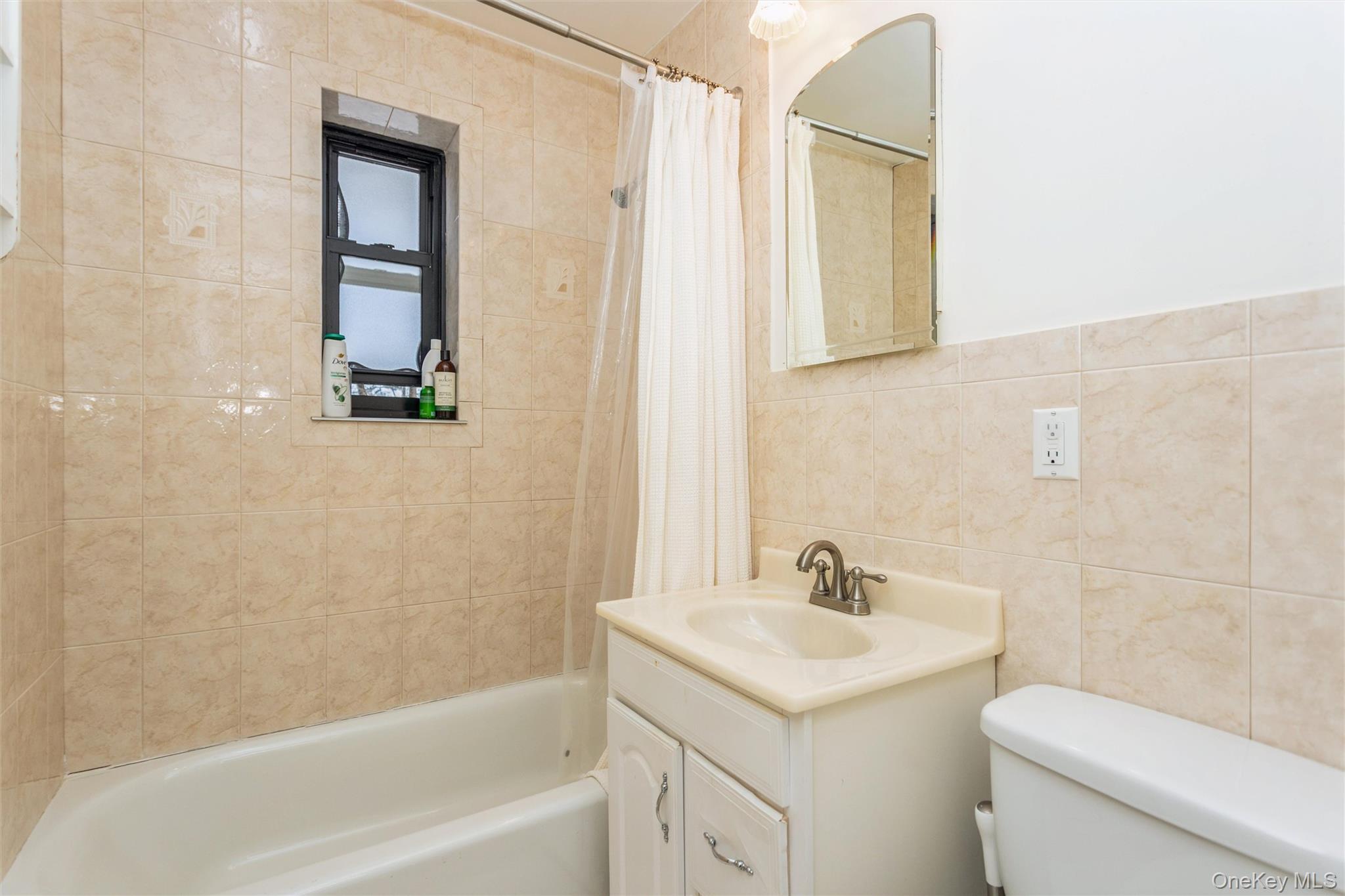 61 Manchester Road, Unit A21 Eastchester, NY 10709 - Photo 13 of 25 a bathroom with a sink a toilet and shower