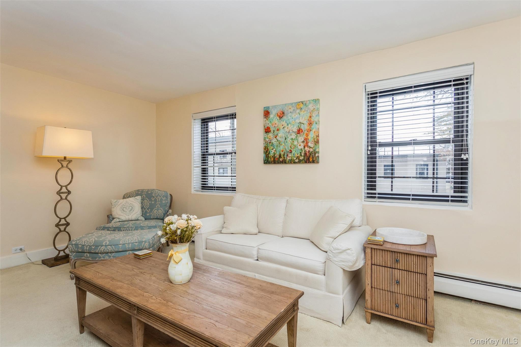 61 Manchester Road, Unit A21 Eastchester, NY 10709 - Photo 5 of 25 a living room with furniture and a window