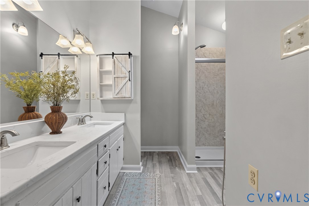 14308 Chimney House Road Midlothian, VA 23112 - Photo 27 of 52 Double vanity with integrated sinks and white cabi