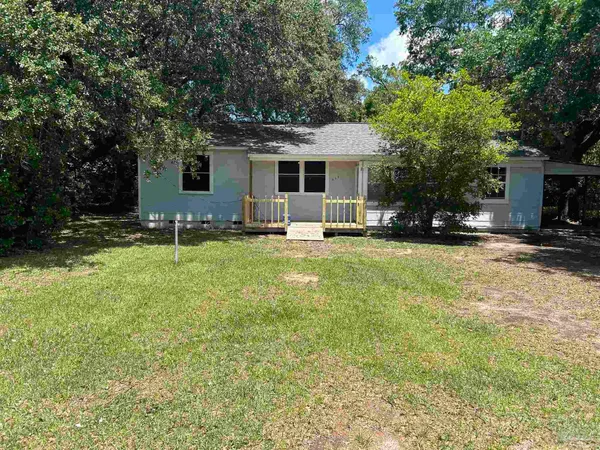 a front view of house with yard and seating area