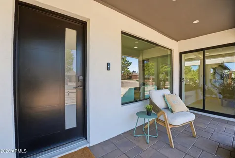 wooden floor in a hall with a couch