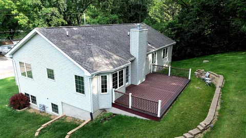 a aerial view of a house with a yard