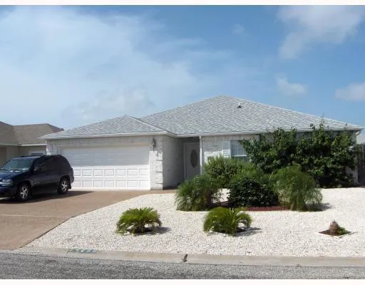 a view of a car parked in front of a house