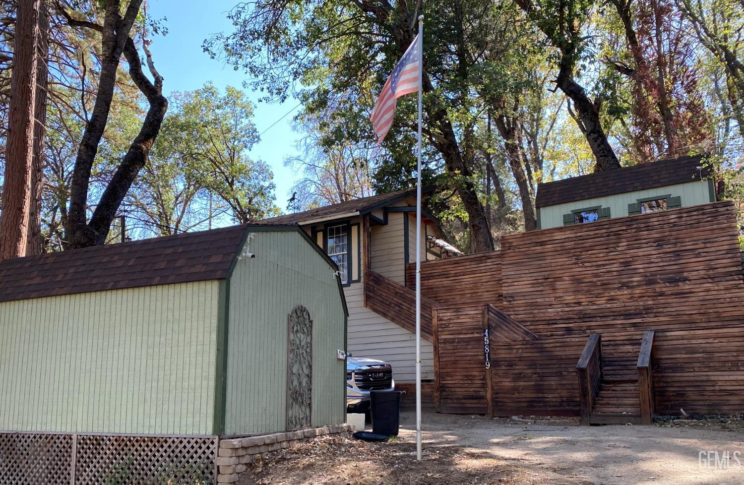 a view of a house with a tree