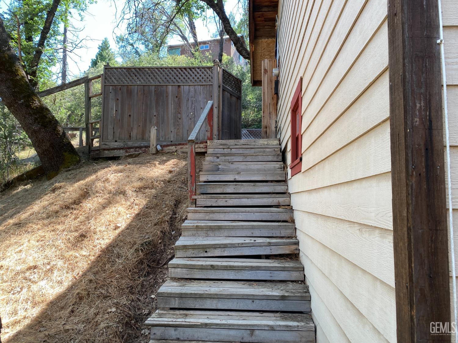 Undisclosed Address Posey, CA 93260 - Photo 21 of 21 a view of entryway with wooden floor and a small yard