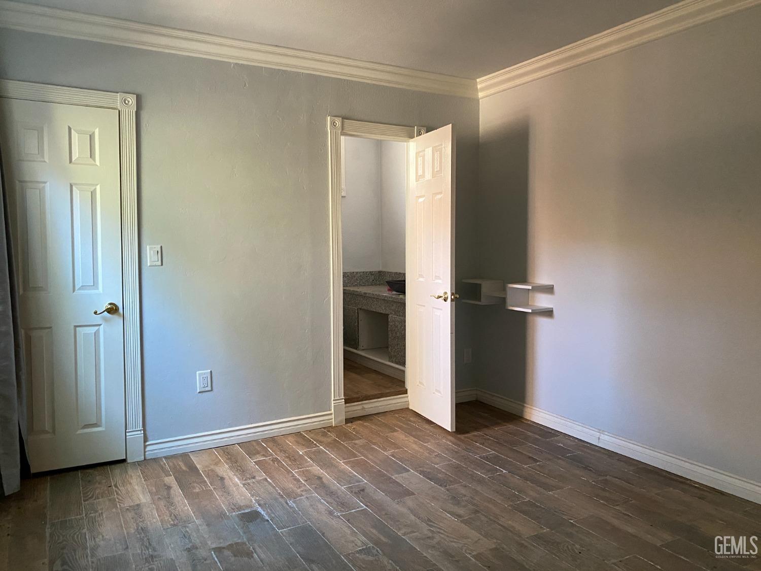 Undisclosed Address Posey, CA 93260 - Photo 4 of 21 an empty room with wooden floor and closet