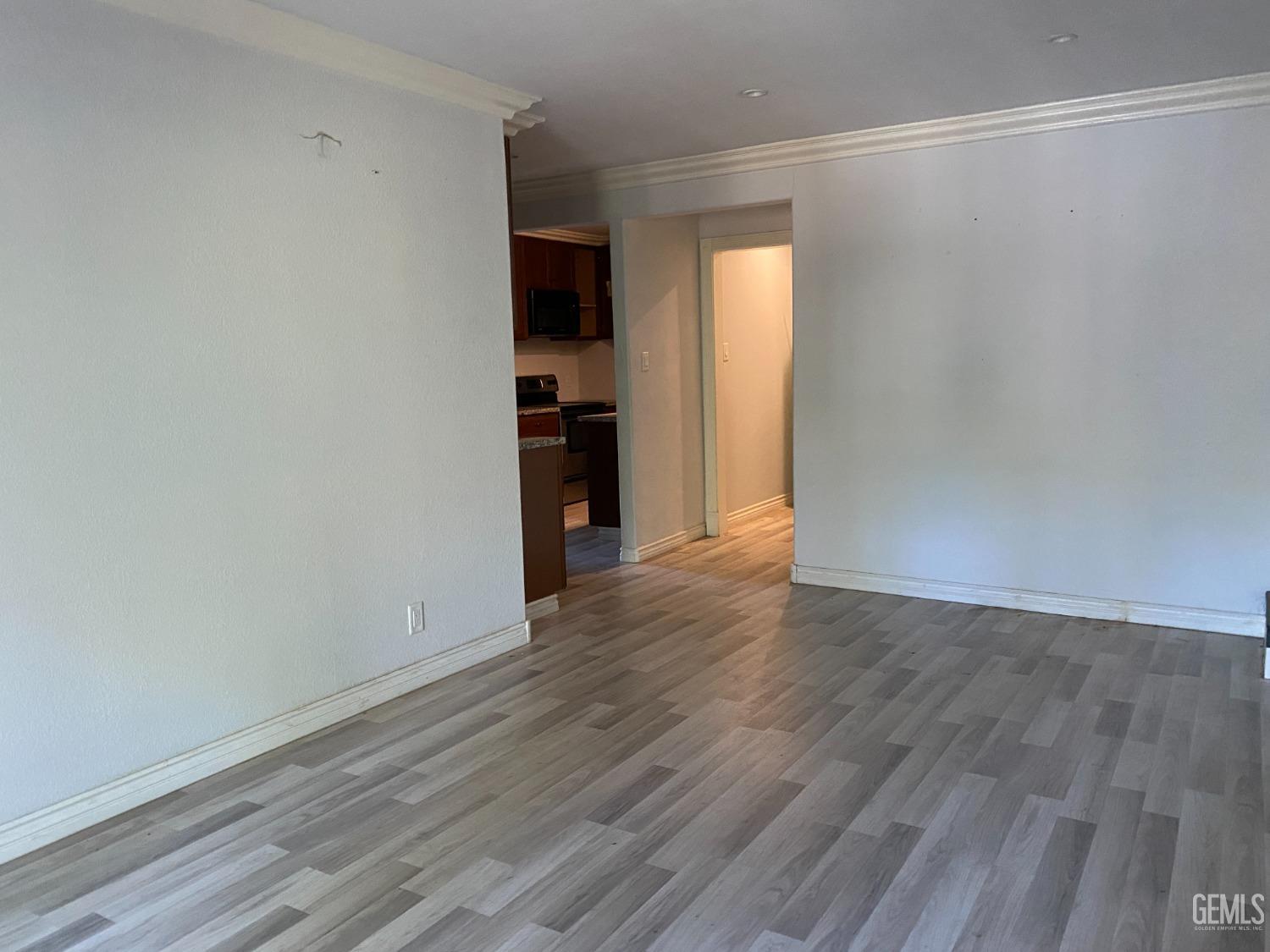Undisclosed Address Posey, CA 93260 - Photo 6 of 21 a view of a room with wooden floor and a window