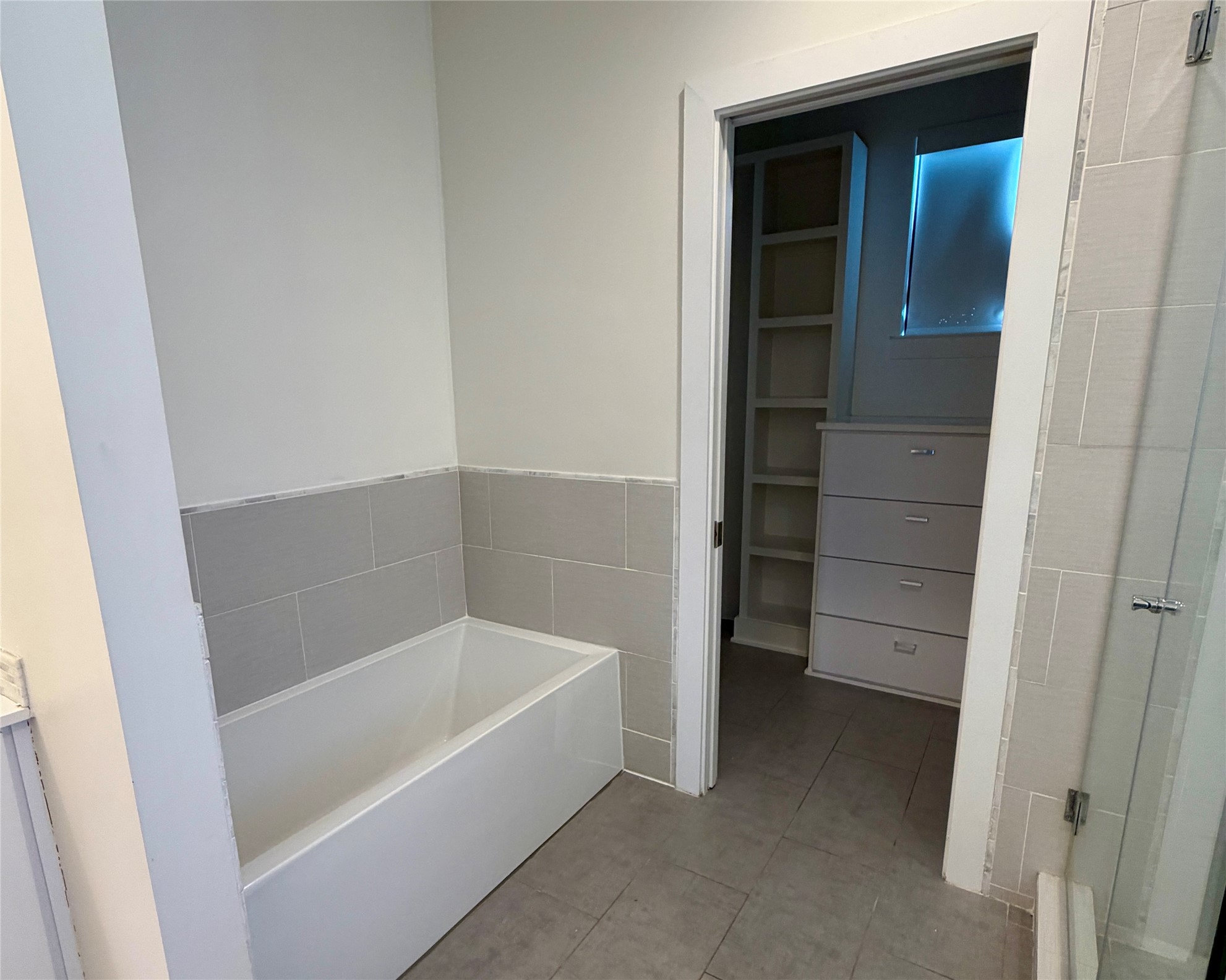 1515 Hether Street, Unit B Austin, TX 78704 - Photo 15 of 30 A well-appointed bathroom with a spacious tub and convenient adjoining closet storage.