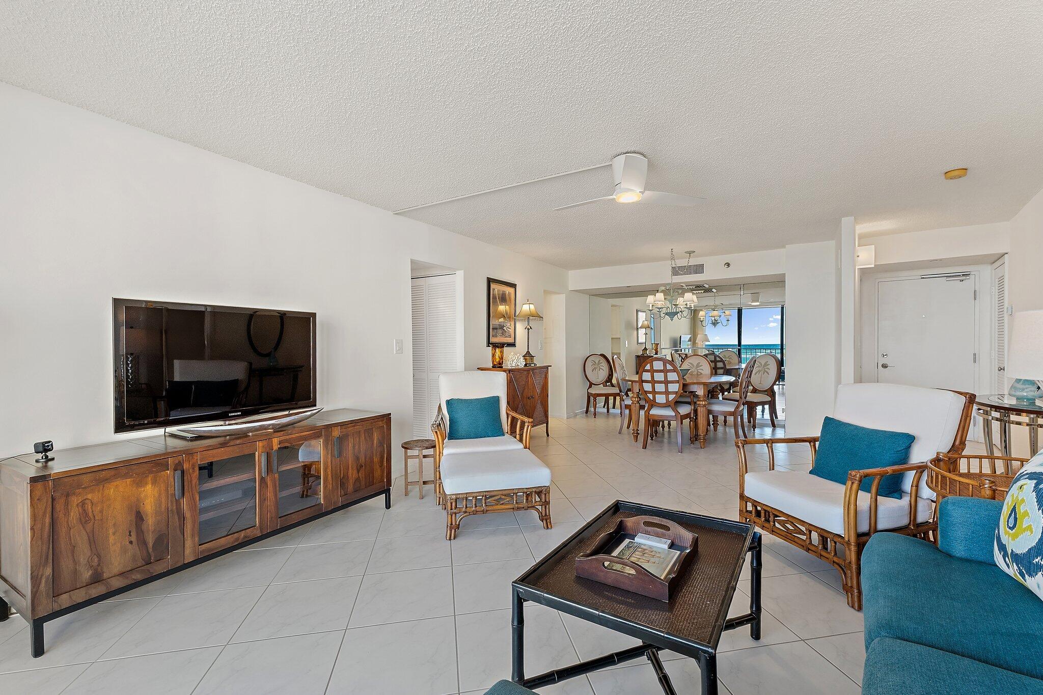 100 Ocean Trail Way, Unit 405 Jupiter, FL 33477 - Photo 11 of 38 a living room with furniture and a flat screen tv