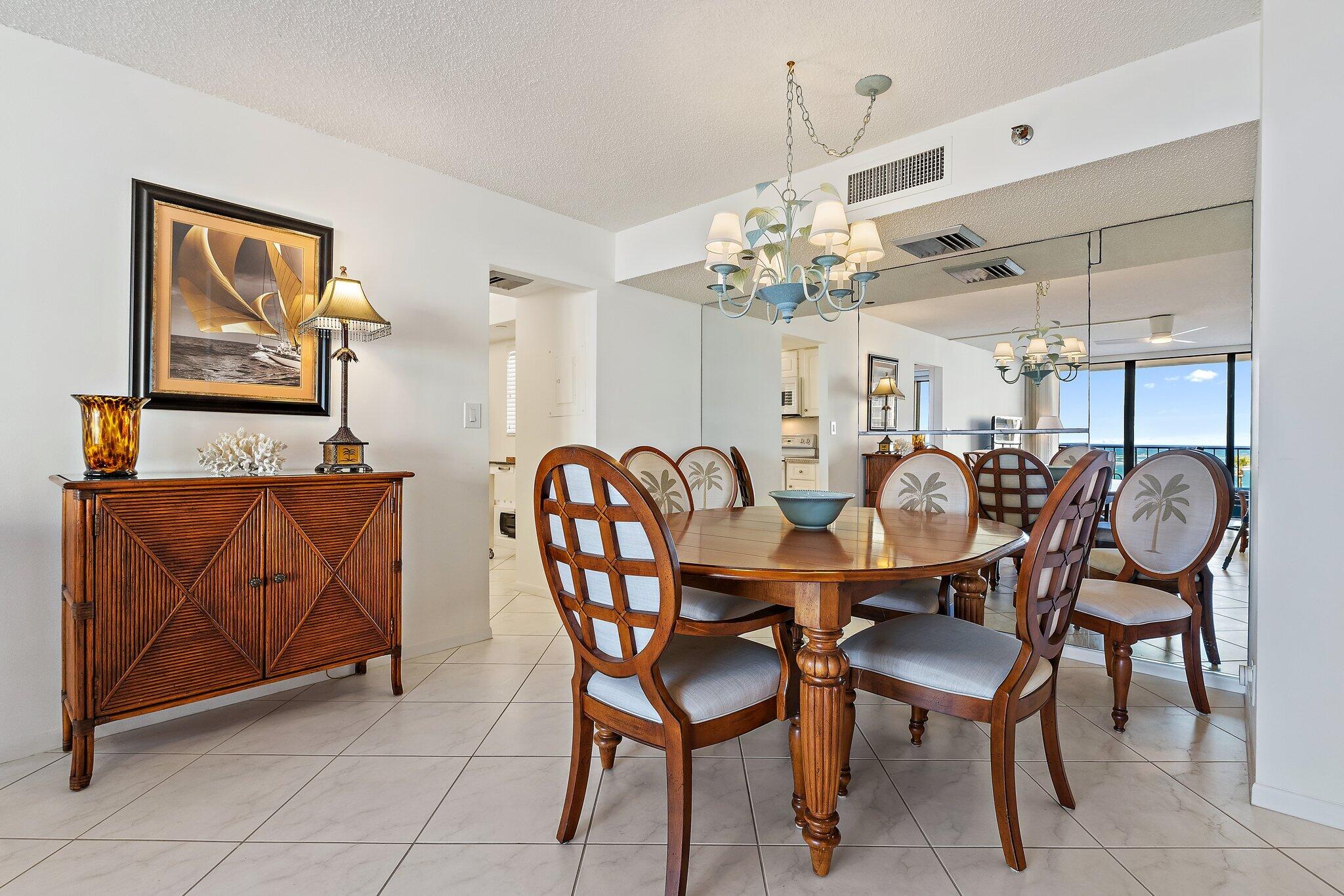100 Ocean Trail Way, Unit 405 Jupiter, FL 33477 - Photo 13 of 38 a view of a dining room with furniture