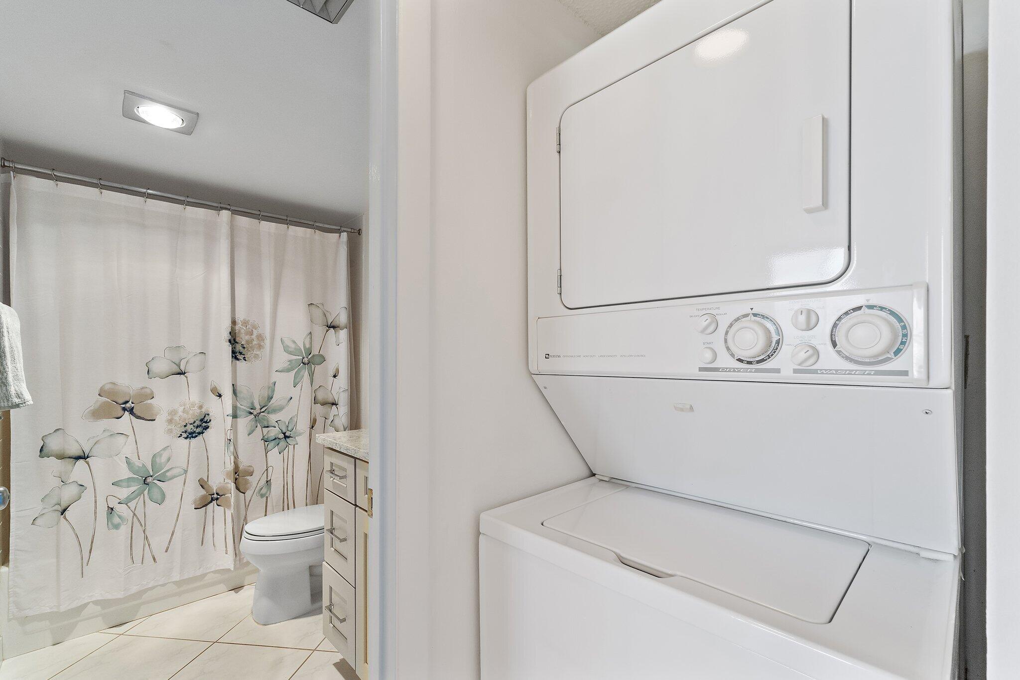 100 Ocean Trail Way, Unit 405 Jupiter, FL 33477 - Photo 28 of 38 a utility room with dryer and washer