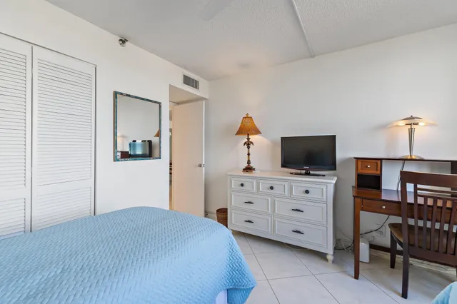 a bedroom with a bed and furniture