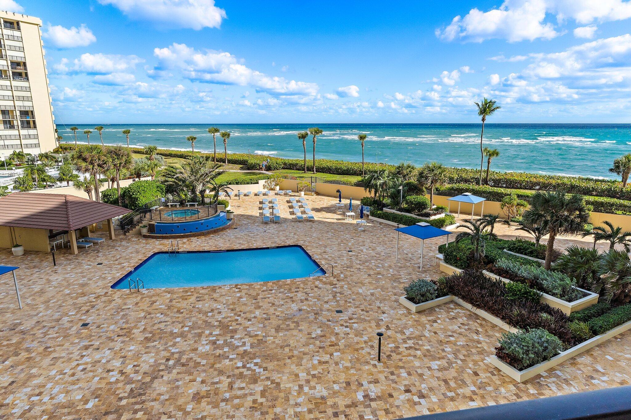 100 Ocean Trail Way, Unit 405 Jupiter, FL 33477 - Photo 36 of 38 swimming pool view with a garden space