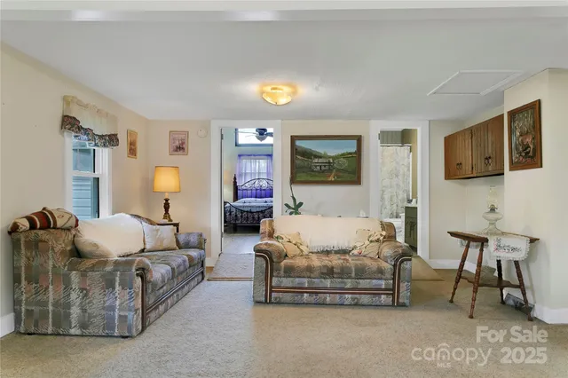 a bedroom with furniture and a lamp