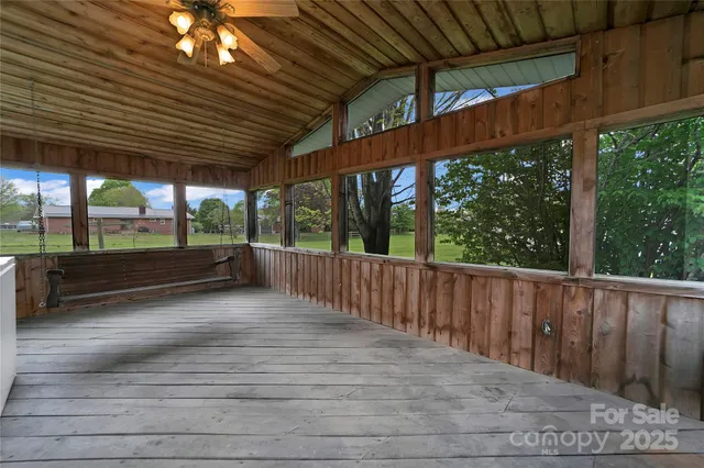 a view of porch with wooden floor
