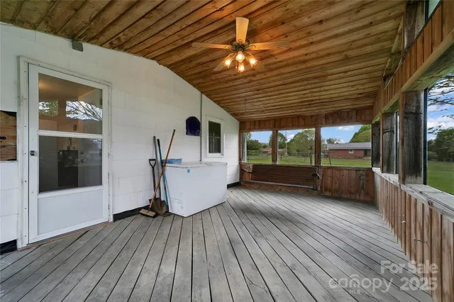 a front view of house with yard and trees