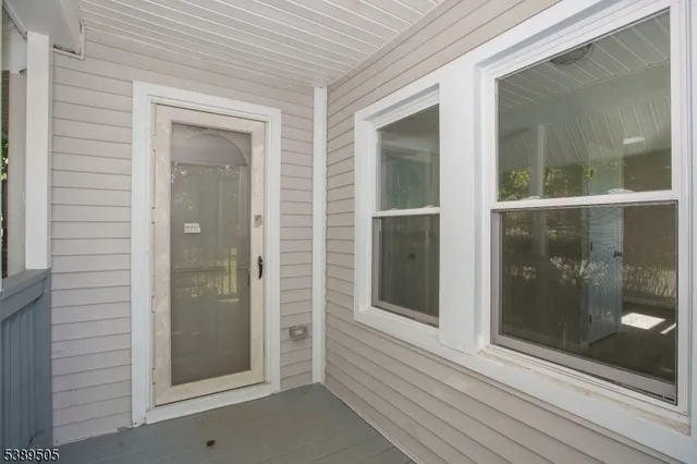 a view of balcony with wooden floor