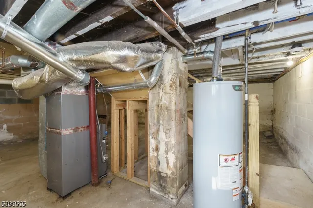 a view of empty room with wooden ceiling