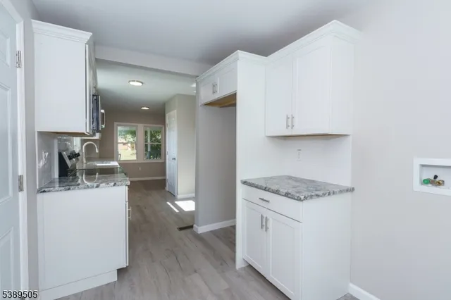 a kitchen with a stove and a microwave