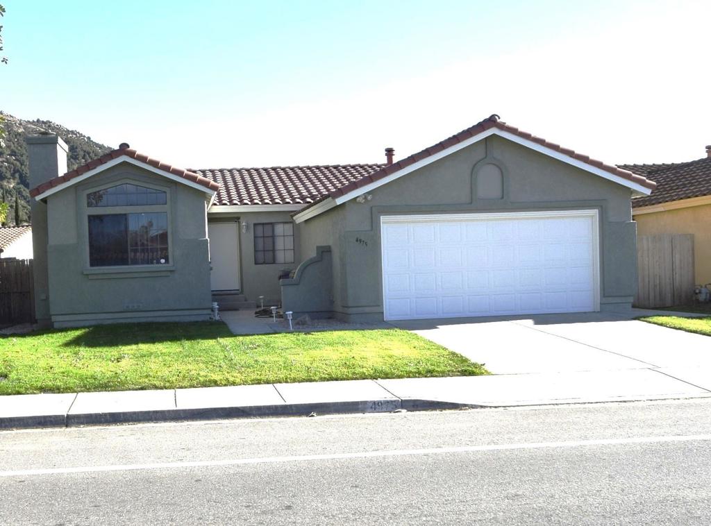 4975 Dulin Road Fallbrook, CA 92028 - Photo 1 of 1 a front view of a house with a yard and garage