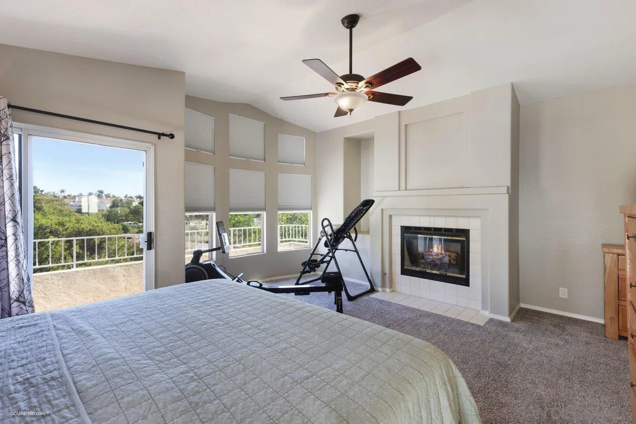 3707 Via Del Rancho Oceanside, CA 92056 - Photo 24 of 45 a bedroom with a bed and a chandelier