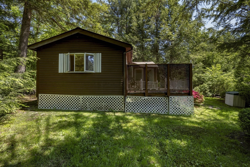 27 Pond Hill Road Goshen, MA 01096 - Photo 3 of 40 a front view of a house with a yard