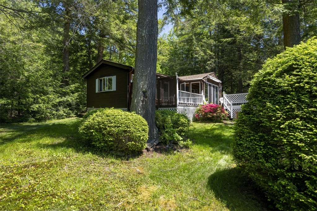 27 Pond Hill Road Goshen, MA 01096 - Photo 5 of 40 a front view of a house with garden