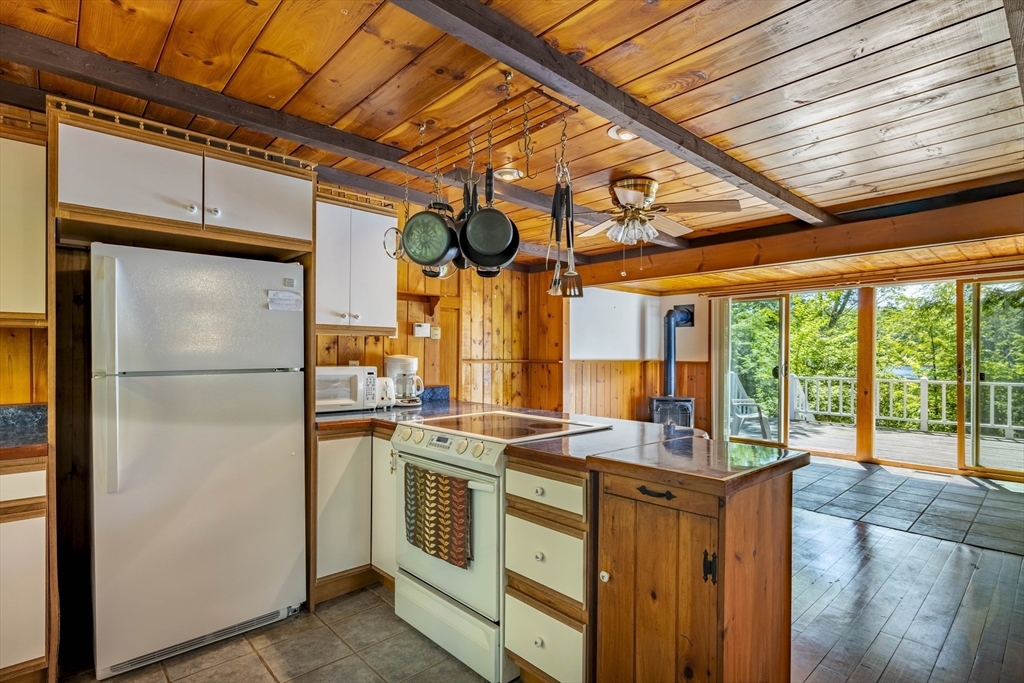 27 Pond Hill Road Goshen, MA 01096 - Photo 6 of 40 a kitchen with stainless steel appliances granite countertop a refrigerator and a stove