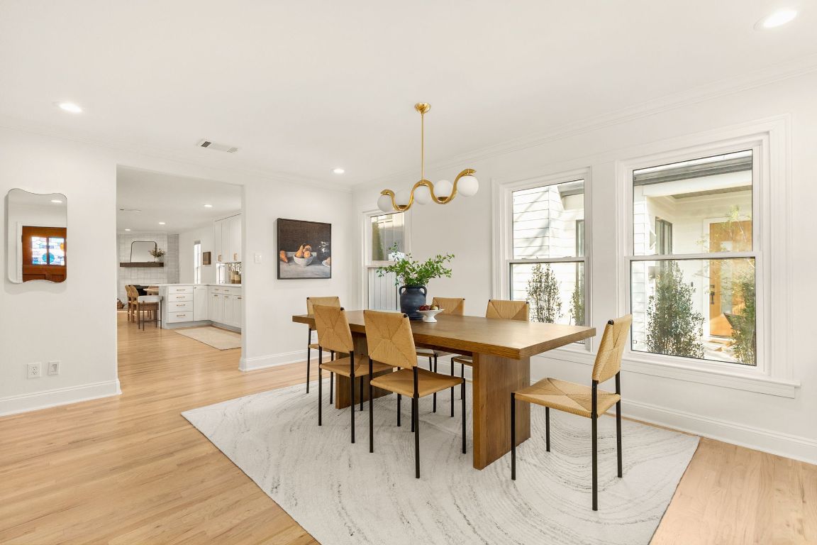 4312 Rosedale Avenue Austin, TX 78756 - Photo 11 of 40 Dining space featuring recessed lighting, light wood-style floors, and crown molding