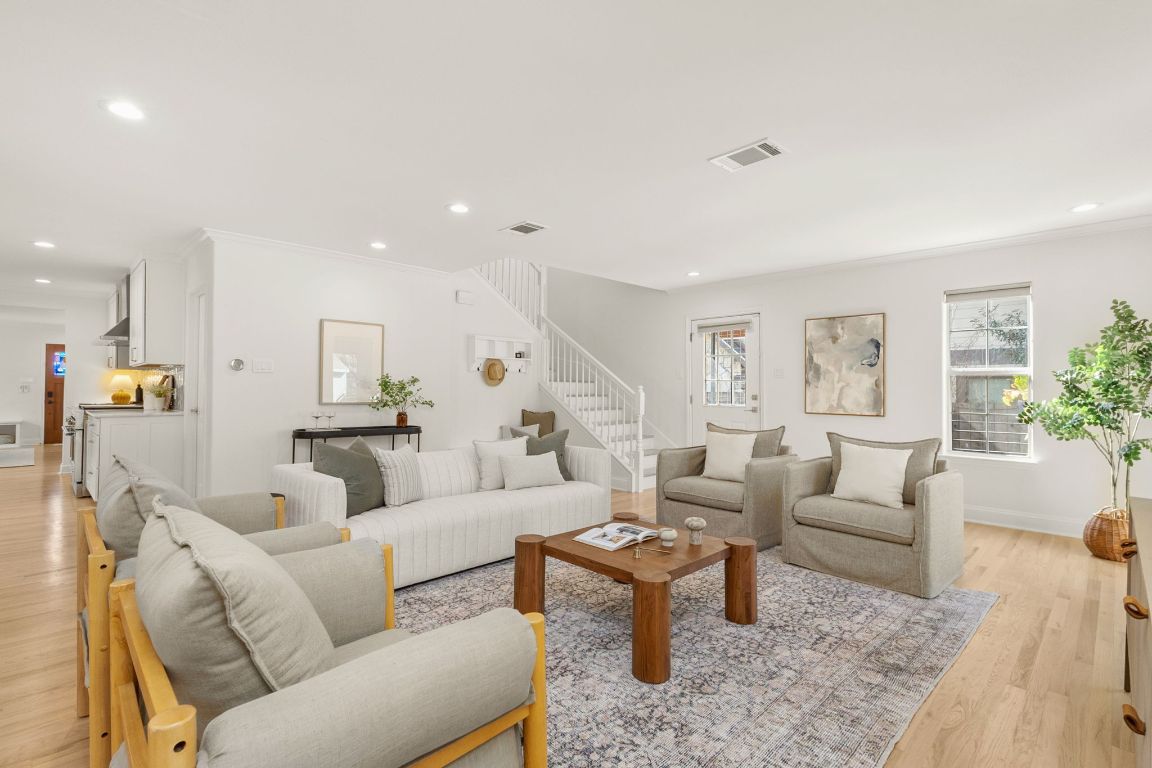4312 Rosedale Avenue Austin, TX 78756 - Photo 19 of 40 Living area featuring light wood-type flooring, ornamental molding, stairway, and recessed lighting