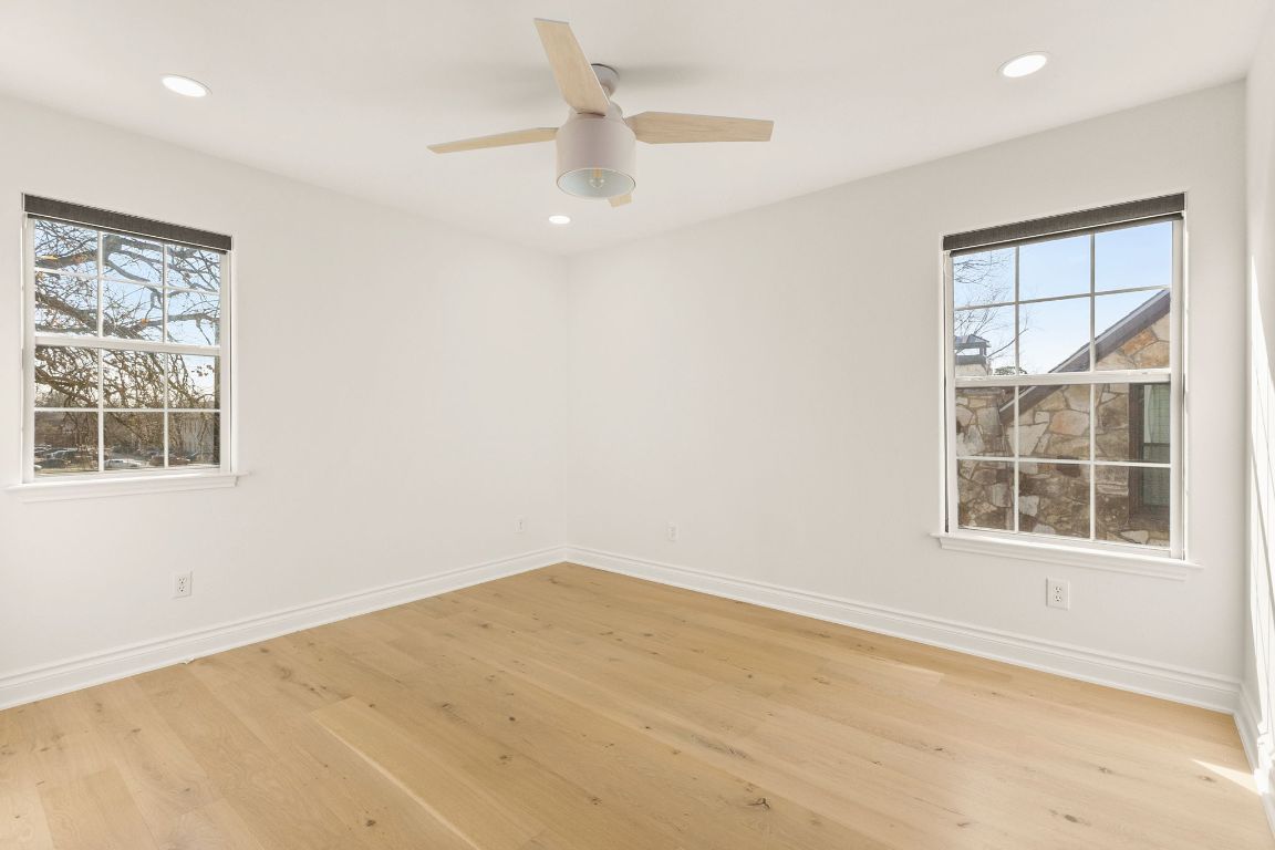 4312 Rosedale Avenue Austin, TX 78756 - Photo 30 of 40 Bedroom with light wood finished floors, recessed lighting, and ceiling fan