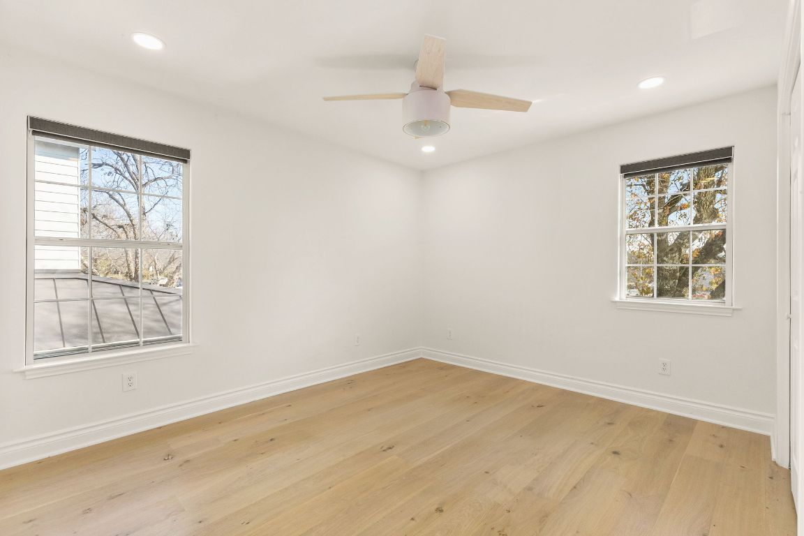 4312 Rosedale Avenue Austin, TX 78756 - Photo 31 of 40 Bedroom with light wood finished floors, ceiling fan, and recessed lighting